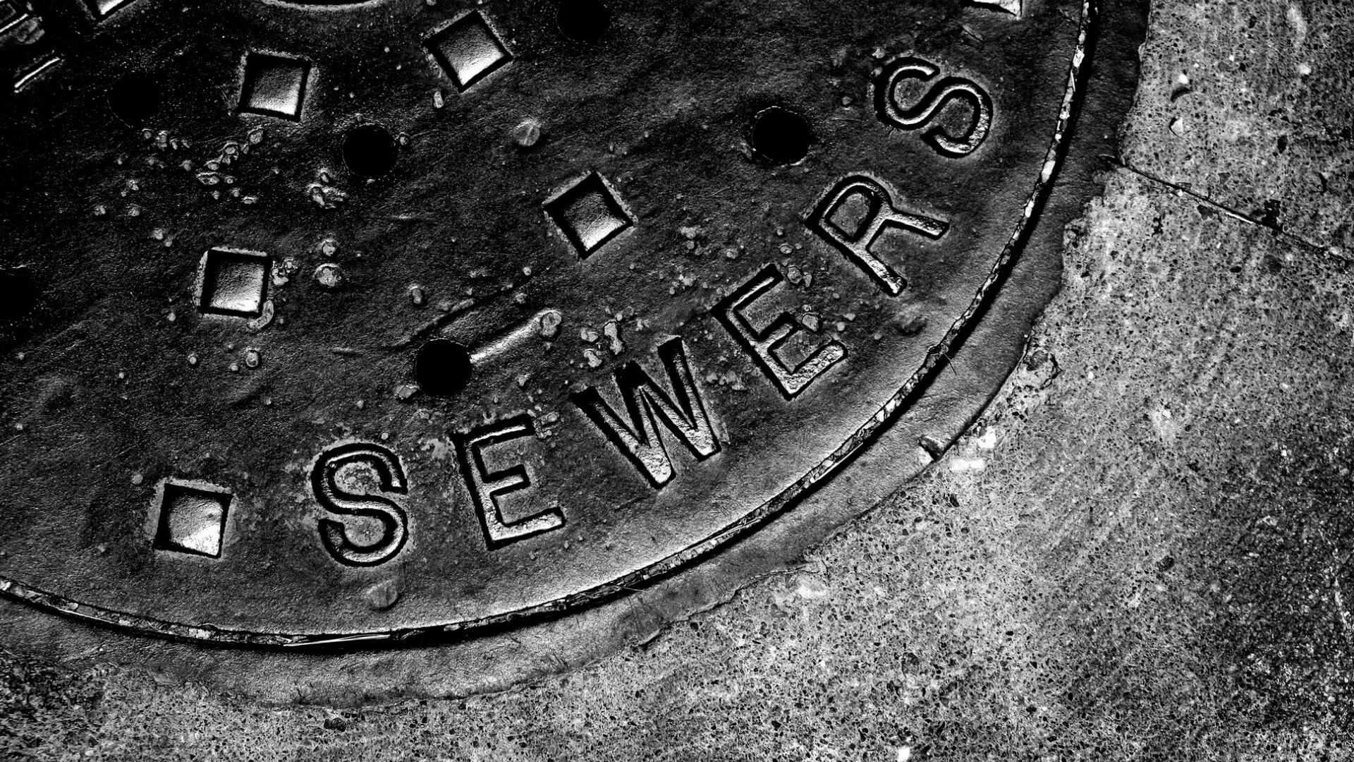 Close-up of sewer manhole cover in California municipal wastewater infrastructure system