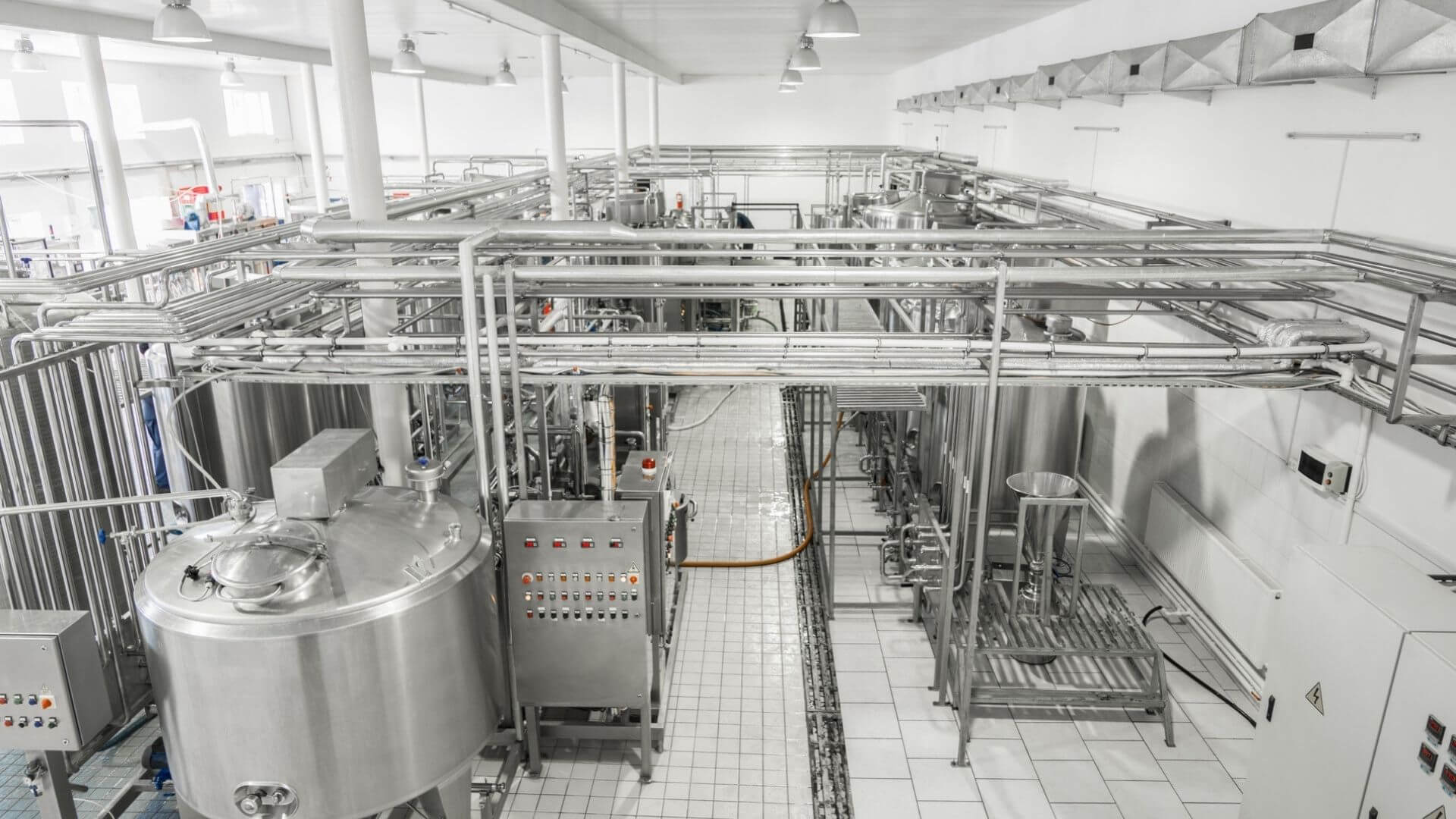 Industrial stainless steel processing tanks and piping system in California chemical manufacturing facility