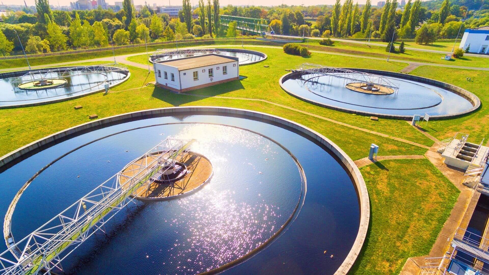 Aerial view of circular clarifier tanks at wastewater treatment plant in California municipal facility