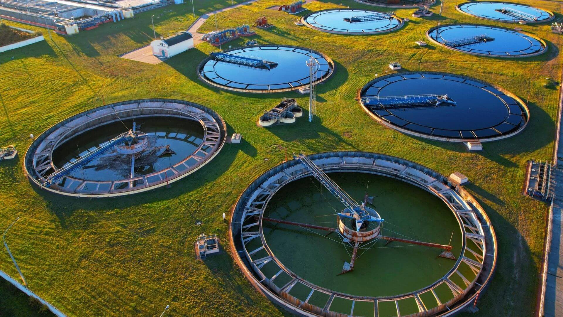 Aerial view of circular clarifier tanks at California wastewater treatment plant supporting municipal water management