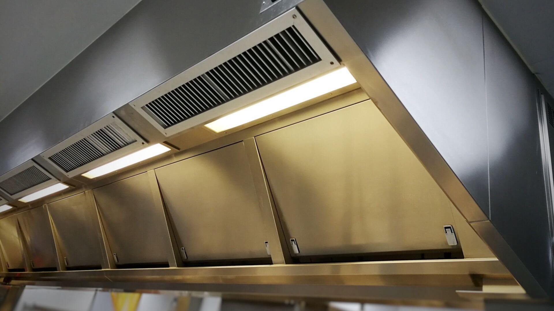 Commercial kitchen exhaust hood system for FOG compliance and ventilation management in California facility