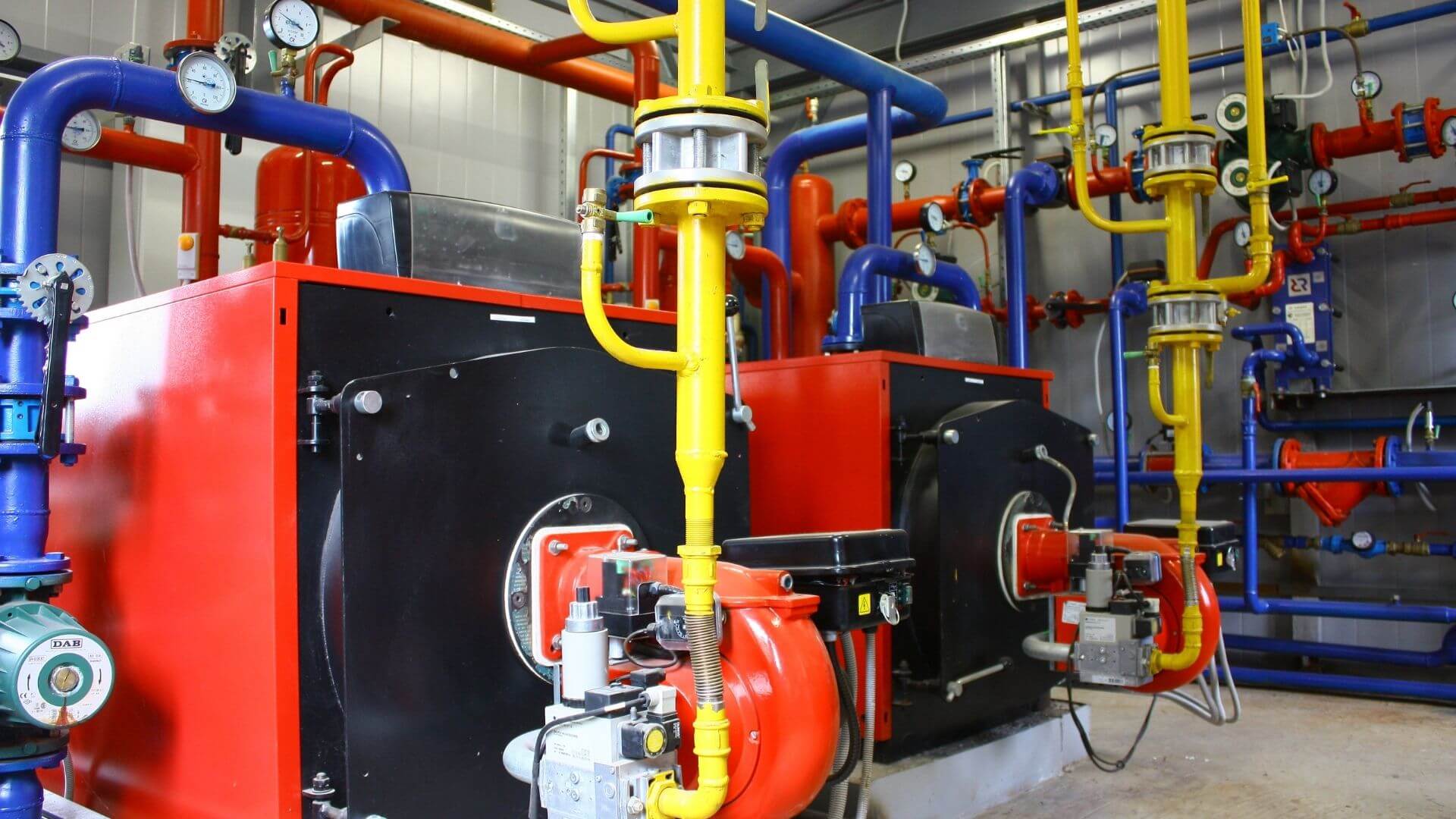 Industrial boiler system with gas lines and heat transfer piping for California commercial facility