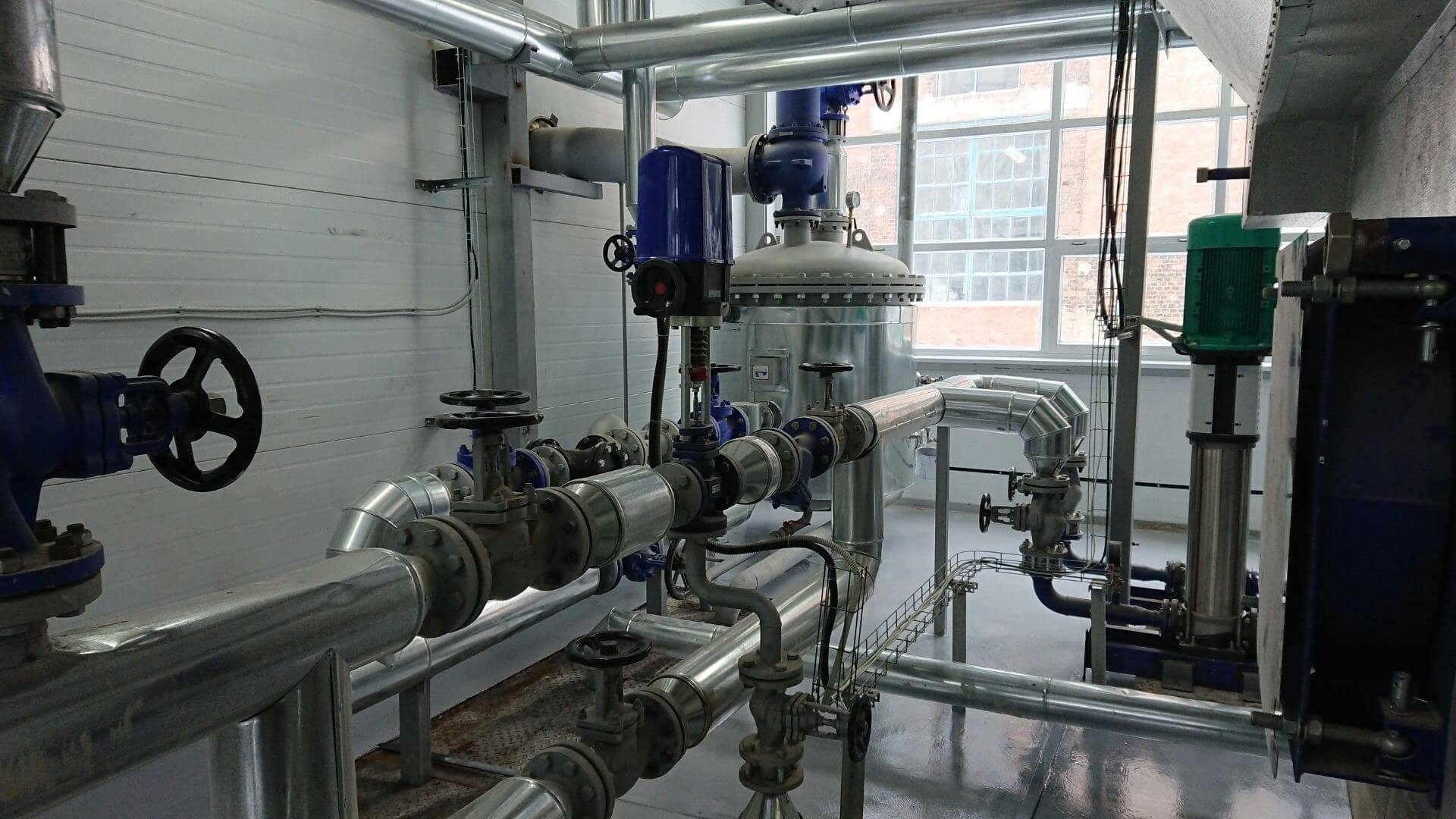 Industrial pump and stainless steel piping system for water treatment and chemical distribution in California facility
